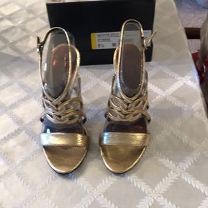 Carlos Santana, size 5-1/2, metallic gold high heels. New never worn in box.